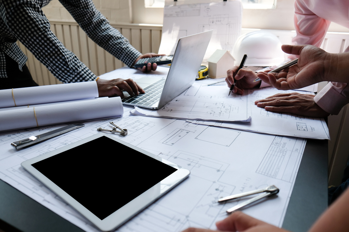 Architectural Team Designing Blueprints